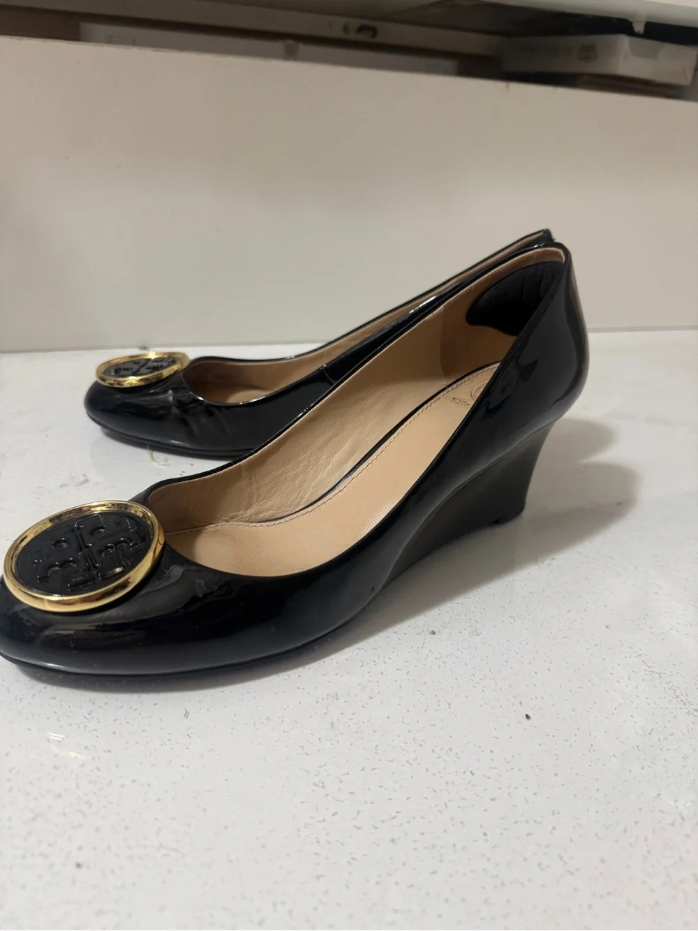 Tory Burch Black Patent Leather Wedge Flats with Gold Logo Medallions